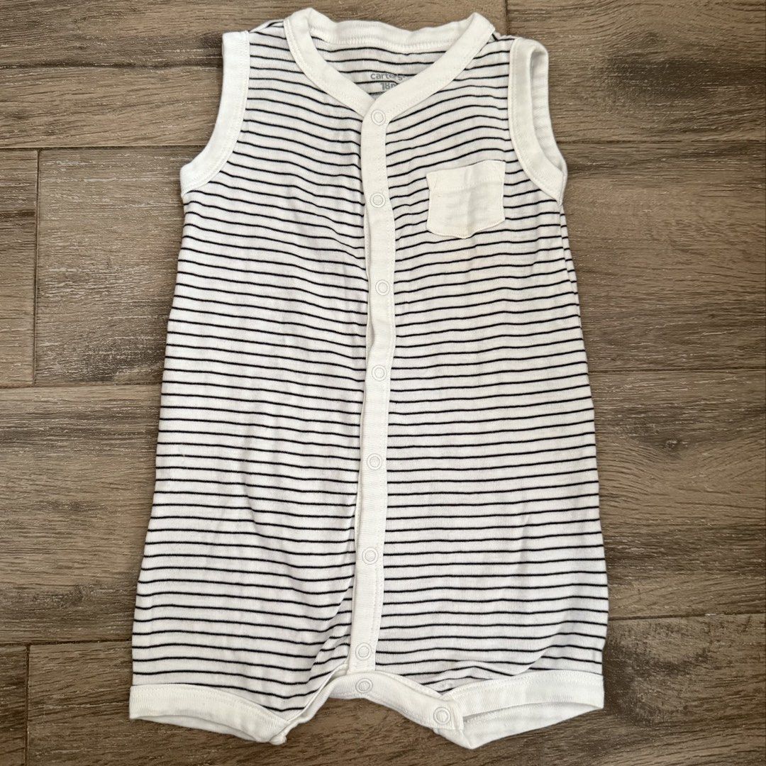 Carter's Striped Sleeveless Romper 18M (Category: Babies & Kids Fashion) located in Marikina City. Submitted by lovegoeson (Listing ID 1467837819, Image 1). Description: - Brand: Carter's - Size: 18 months - Color/Pattern: Classic black and white stripes - Material: Soft, comfortable ribbed fabric - Design: Sleeveless with a small left chest pocket - Convenience: Snap buttons down the front and legs for quick diaper changes - Origin: Made in Indi
