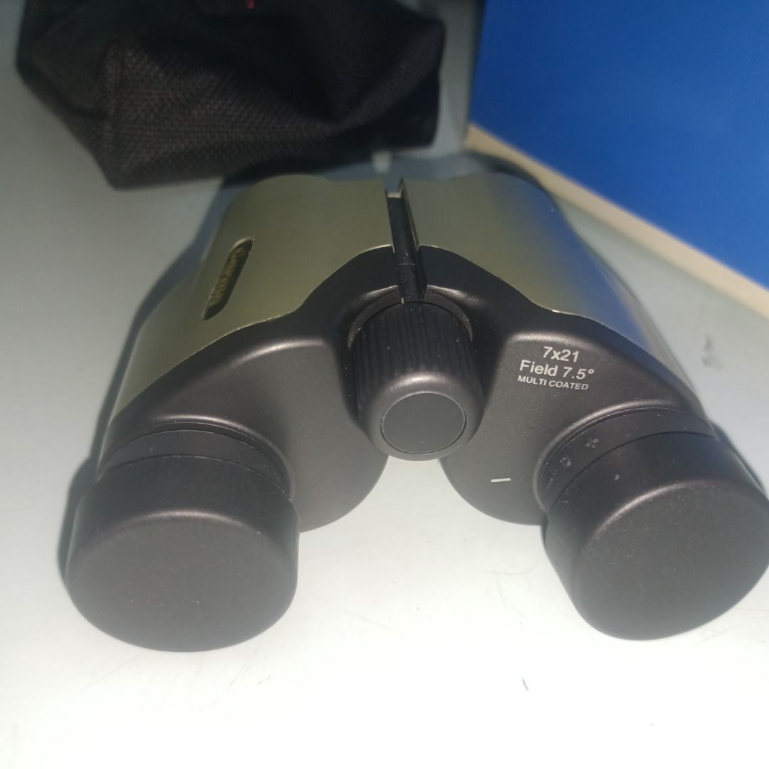 Carton 7x21 Multi Coated Binoculars (Category: Hiking & Camping) located in Munoz. Submitted by larryc1212 (Listing ID 1467676700, Image 2). Description: - Model: Carton 7x21 Binoculars - Optics: Multi-coated lenses with a 7.5-degree field of view - Design: Compact and portable, perfect for outdoor viewing and sports events - Inclusions: Original box, soft case, neck strap, lens cleaning cloth, and instruction manual - Condition: Excellent, compl
