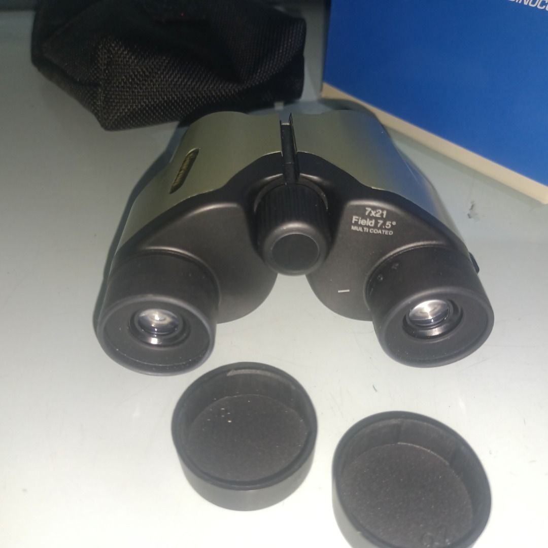 Carton 7x21 Multi Coated Binoculars (Category: Hiking & Camping) located in Munoz. Submitted by larryc1212 (Listing ID 1467676700, Image 1). Description: - Model: Carton 7x21 Binoculars - Optics: Multi-coated lenses with a 7.5-degree field of view - Design: Compact and portable, perfect for outdoor viewing and sports events - Inclusions: Original box, soft case, neck strap, lens cleaning cloth, and instruction manual - Condition: Excellent, compl