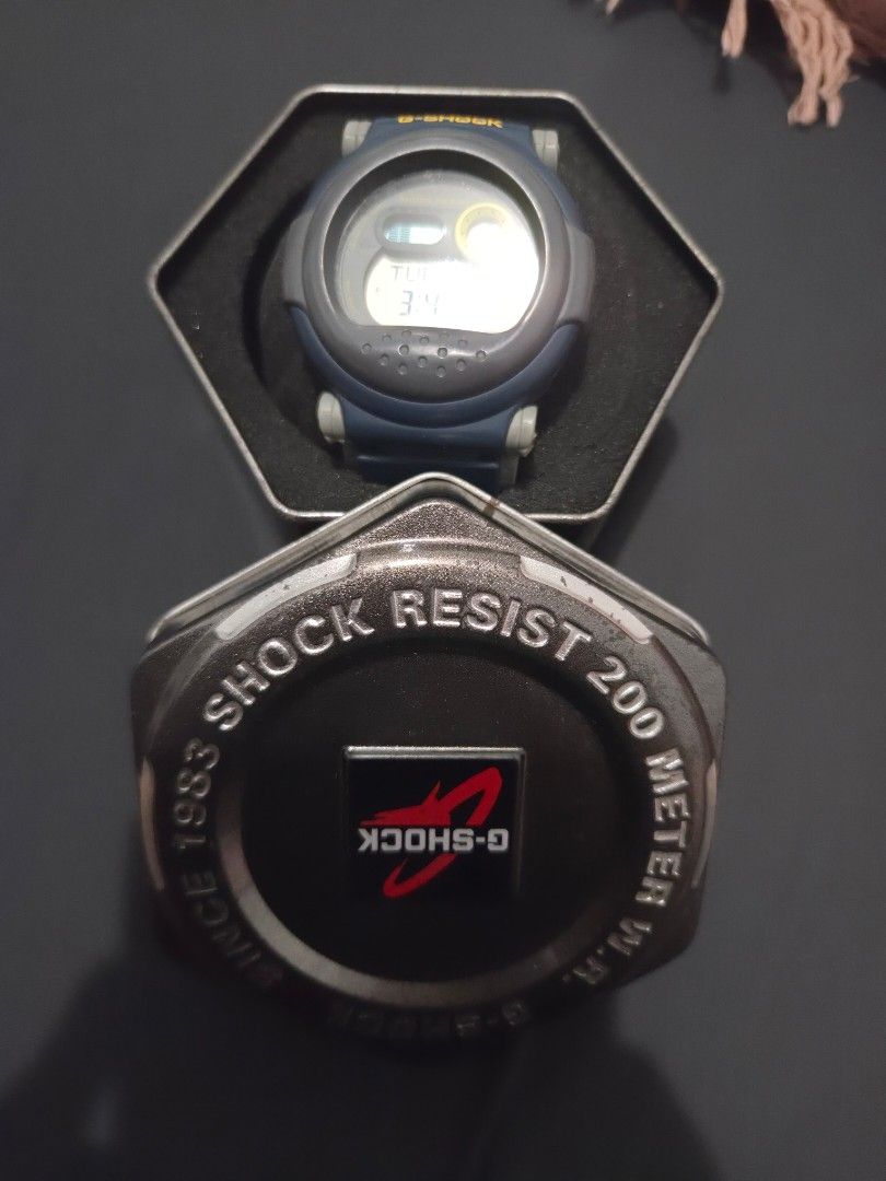 Casio G-Shock, Shock Resist 200 Meter Watch (Category: Men's Watches) located in Quezon City. Submitted by sashasarisarishoppe (Listing ID 1467670620, Image 2). Description: - Authentic Casio G-Shock digital watch - Striking blue and grey design with eye-catching yellow side buttons - Shock resistant structure built for durability - 200-meter water resistance rating for swimming and diving - Multi-functional digital display dial - Includes origin