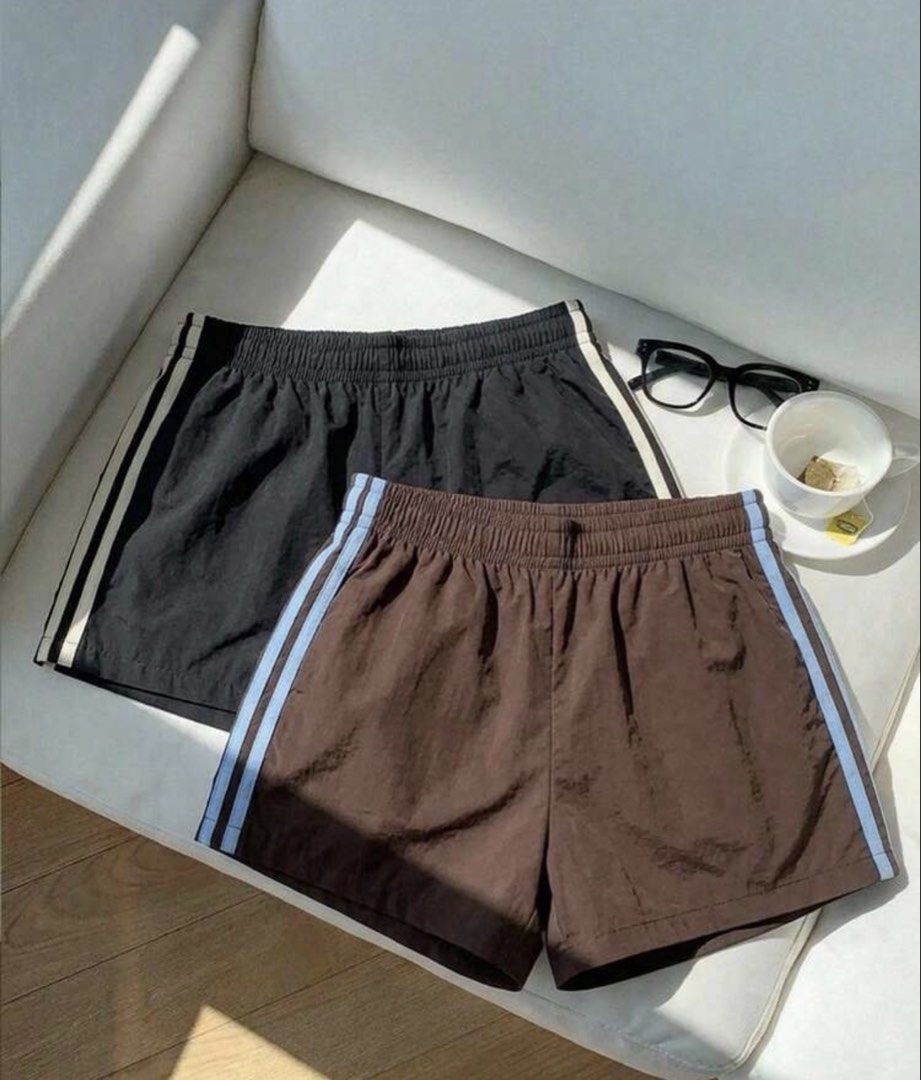 Casual Athletic Shorts 2-Pack Black Brown (Category: Shorts) located in Muntinlupa City. Submitted by myabcshop (Listing ID 1467725369, Image 1). Description: - Set of 2 casual athletic shorts: Black/White stripes & Brown/Light blue stripes - Comfortable elastic waistband with a relaxed fit - Lightweight, breathable nylon material - Ideal for lounging, running errands, or light workouts - Easy to pair with basic tees and sneakers - Size: [Insert 