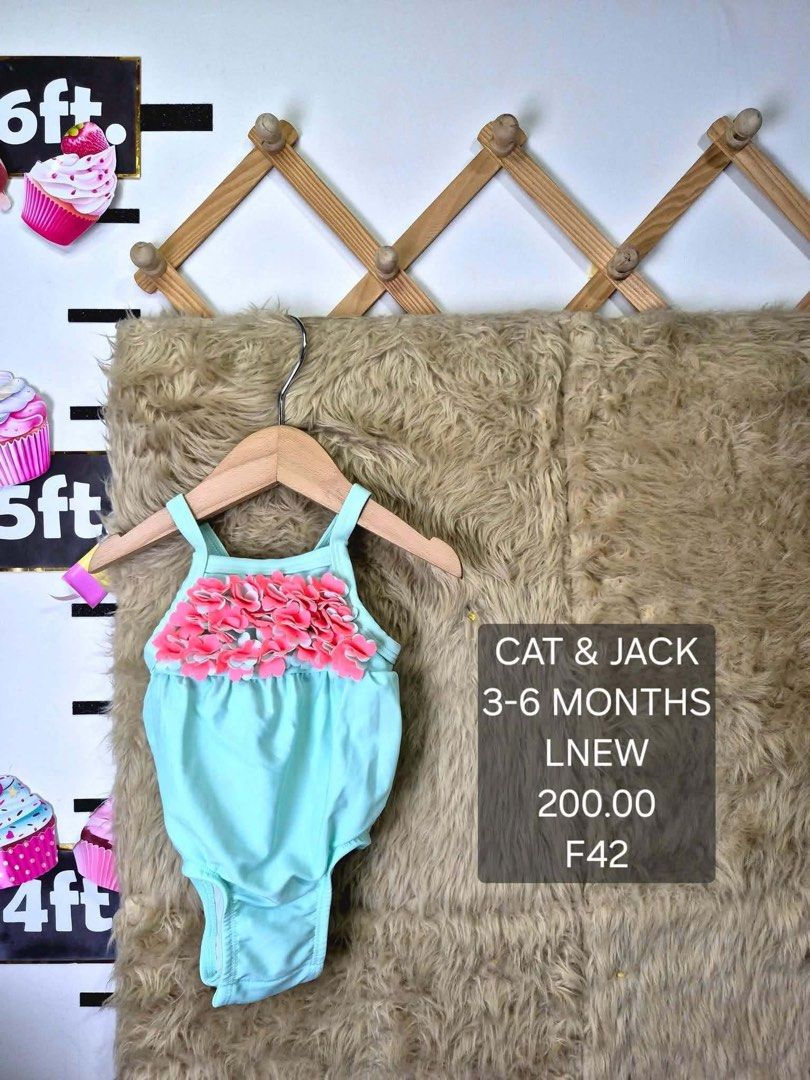 Cat & Jack 3-6 Months Swimsuit (Category: Babies & Kids Fashion) located in Jaen. Submitted by kmg0219 (Listing ID 1467607767, Image 1). Description: - Brand: Cat & Jack - Size: 3-6 months - Color: Light blue with bright pink floral ruffles - Design: Thin shoulder straps, one-piece cut.