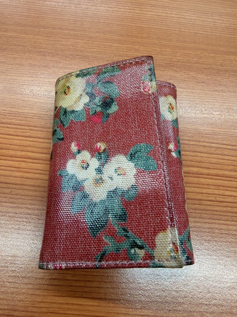 Cath Kidston Floral Key Case Wallet (Category: Wallets & Card holders) located in Quezon City. Submitted by ellamenopi (Listing ID 1467606511, Image 3). Description: - Brand: Cath Kidston - Design: Classic red floral print - Material: Durable, wipeable coated canvas - Closure: Double snap button front with secure interior snaps - Features: Fabric brand patch at the bottom corner - Size: Compact and pocket-friendly, perfect for keeping keys organi
