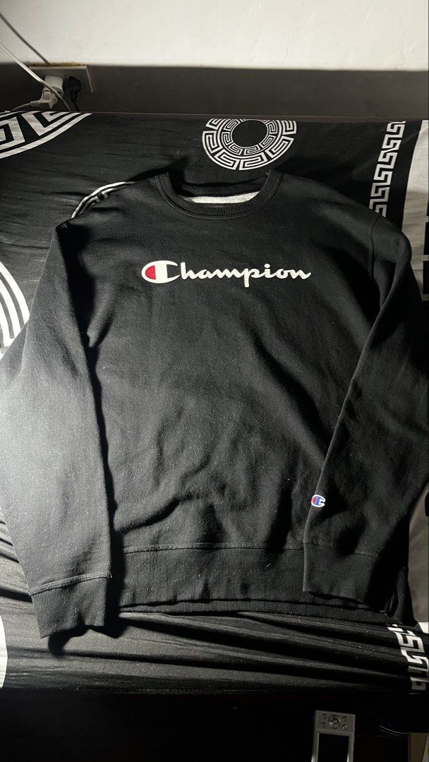 Champion Black Script Logo Crewneck Sweatshirt (Category: Coats, Jackets and Outerwear) located in Caloocan City. Submitted by drip_archive (Listing ID 1467826940, Image 2). Description: - Authentic black Champion crewneck sweatshirt - Iconic script logo across the chest - Signature embroidered Champion C patch on the left sleeve cuff - Ribbed collar, cuffs, and hem for a snug fit - Comfortable cotton blend fabric, ideal for casual wear and layer