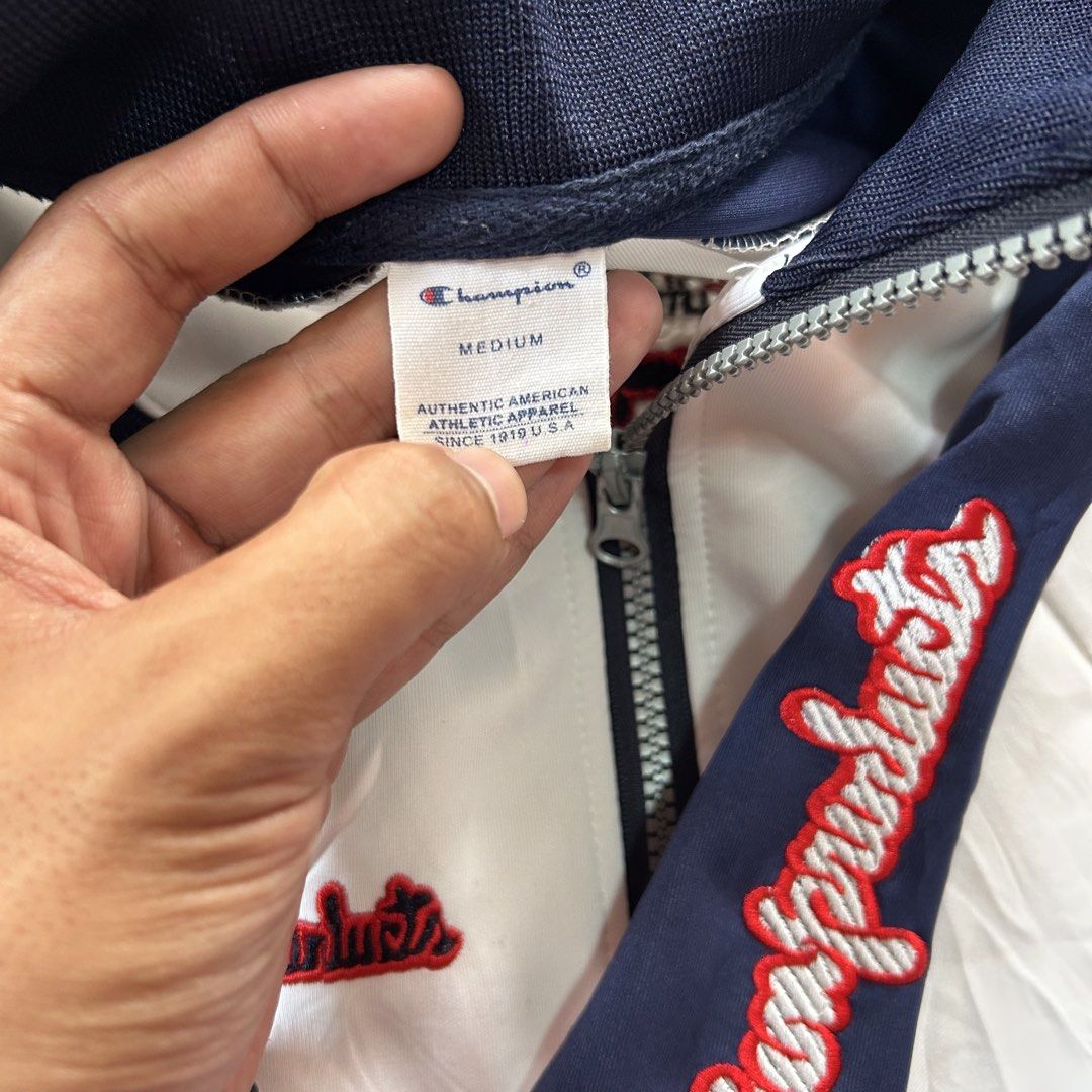 Champion vintage colourblock track jacket 🥵 (Category: Coats, Jackets and Outerwear) located in Jinoba-an. Submitted by eegiboy (Listing ID 1467649812, Image 2). Description: - Brand/Style: Vintage Champion colourblock track jacket - Colourway: White, navy blue, and red - Size: Medium - Design: Full zip front, stand collar, front slash pockets, elastic cuffs and hem - Details: Striking embroidered Champion graphics down the left sleeve, chest, b