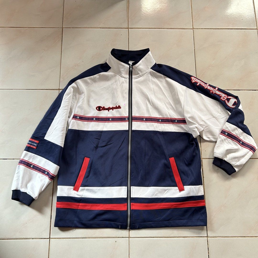 Champion vintage colourblock track jacket 🥵 (Category: Coats, Jackets and Outerwear) located in Jinoba-an. Submitted by eegiboy (Listing ID 1467649812, Image 1). Description: - Brand/Style: Vintage Champion colourblock track jacket - Colourway: White, navy blue, and red - Size: Medium - Design: Full zip front, stand collar, front slash pockets, elastic cuffs and hem - Details: Striking embroidered Champion graphics down the left sleeve, chest, b