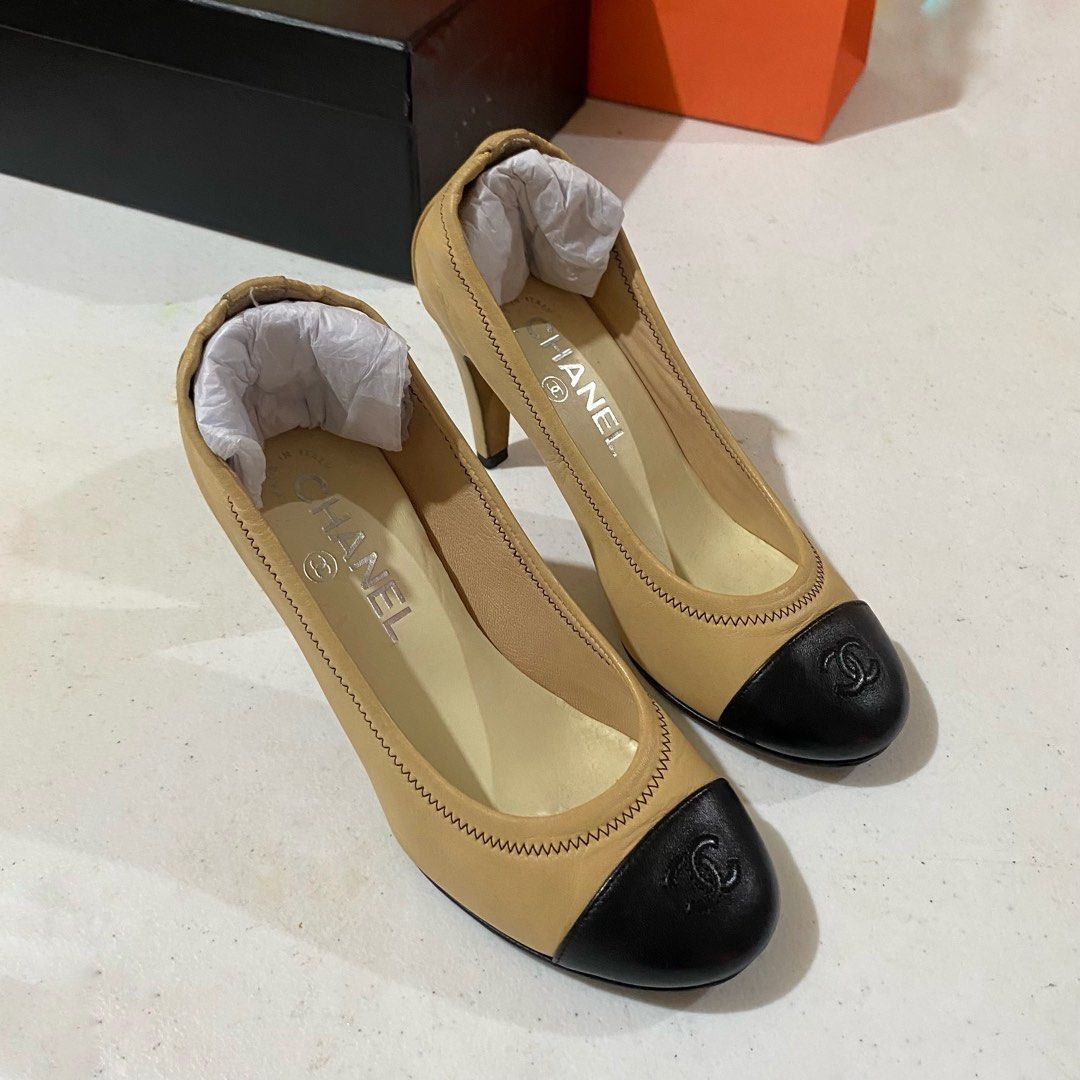 Chanel CC Captoe Lambskin Heels (Category: Heels) located in Bacacay. Submitted by curatedsbyjj (Listing ID 1467722006, Image 1). Description: 100% Authentic Chanel CC Captoe Lambskin Heels in Beige/Black, Elegant designer heels featuring soft lambskin leather and iconic CC logo. Elastic trim style for a more comfy & secured fit. Classic and versatile style. • Size: 36 1/2 C (Insole is 23-23.5 CM) • Heel Height: Approximately 3 inches. • Conditio