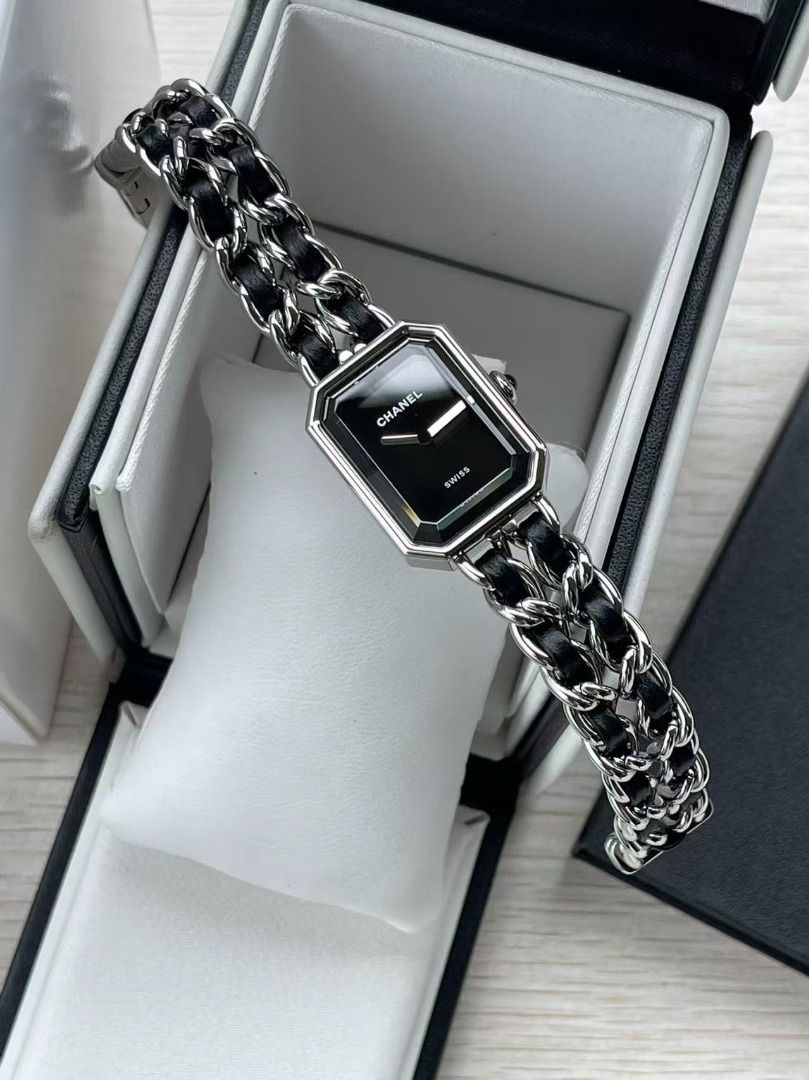 Chanel Premiere Chain Watch Black Dial Silver (Category: Luxury Watches) located in Muntinlupa City. Submitted by azuomaigor72472 (Listing ID 1467693077, Image 1). Description: - Authentic Chanel Premiere watch in excellent condition - Silver-tone metal and black leather interlaced chain strap (worn bracelet-style) - Black rectangular dial with minimalist hands and reliable Swiss movement - Iconic octagonal case inspired by the geometry of Place 