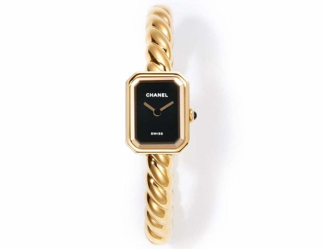 Chanel Premiere Twist Gold Bangle Watch (Category: Women's Watches) located in Paranaque City. Submitted by emoemobern98221 (Listing ID 1467663586, Image 1). Description: - Brand: Chanel Premiere - Design: Gold-tone twisted bangle strap with rectangular black dial - Details: Minimalist hands, crown with dark stone cabochon - Origin: Swiss Made - Style: Classic timepiece that wears like a luxury bracelet - Condition: Clean, polished metal finish a