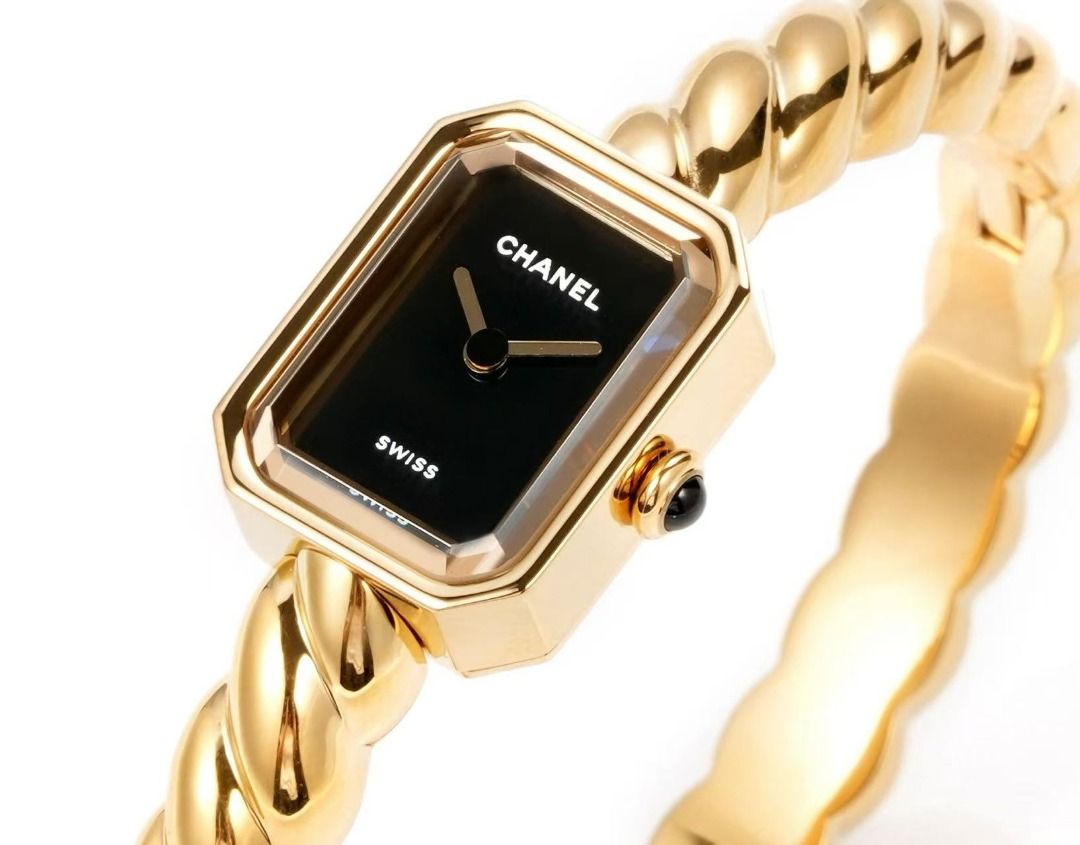 Chanel Premiere Twist Gold Bangle Watch (Category: Women's Watches) located in Paranaque City. Submitted by emoemobern98221 (Listing ID 1467663586, Image 3). Description: - Brand: Chanel Premiere - Design: Gold-tone twisted bangle strap with rectangular black dial - Details: Minimalist hands, crown with dark stone cabochon - Origin: Swiss Made - Style: Classic timepiece that wears like a luxury bracelet - Condition: Clean, polished metal finish a