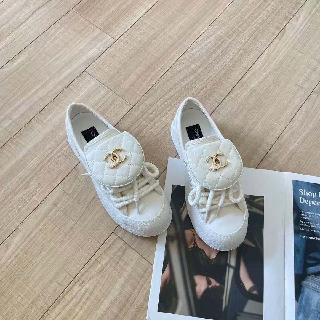Chanel White Quilted Sneakers (Category: Sneakers) located in Manila. Submitted by brangelepo03216 (Listing ID 1467699638, Image 1). Description: - Brand: Chanel - Color: Clean White - Material: Sturdy canvas upper - Design: Quilted flap overlay on laces with gold-tone CC logo hardware - Sole: Chunky textured platform sole for an edgy look - Style: Slip-on aesthetic blended with a classic sneaker design - Fit & Feel: Comfortable for daily wear wh