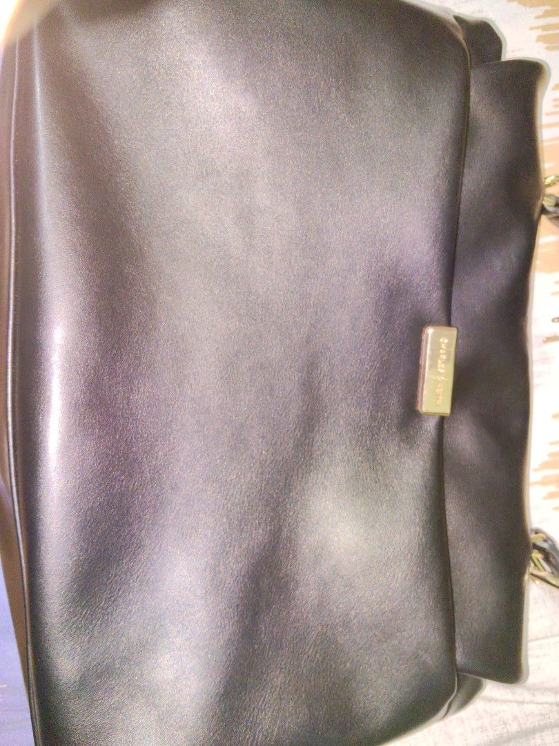 Charles & Keith black Kerry Bag (Category: Shoulder Bags) located in San Pedro. Submitted by eye_spy (Listing ID 1467838975, Image 3). Description: Black shoulder bag from Charles and Keith. Gold tone hardware on the twist lock closure and zipper pull. Adjustable strap attached. Structured silhouette with folded top flap. Interior lined in dark fabric with a branded patch sewn inside. Clean surfaces all around. used twice only. no issues. looks n