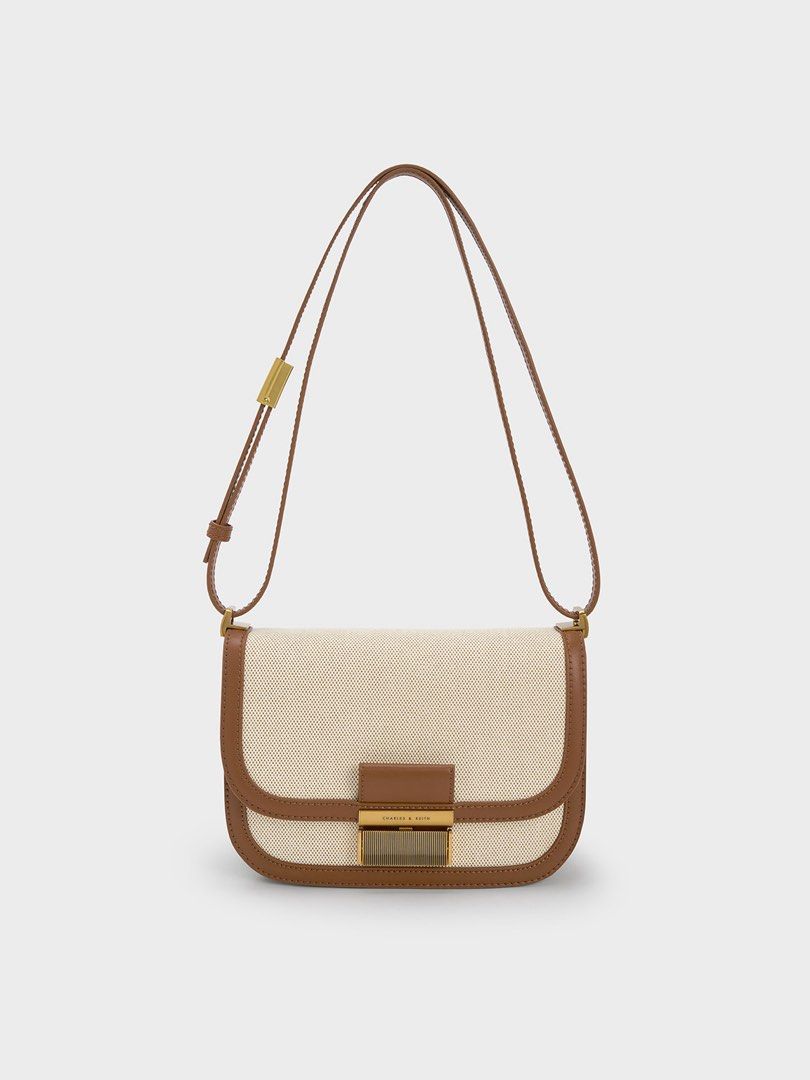 Charles & Keith Canvas and Brown Leather Crossbody Bag (Category: Cross-body Bags) located in Quezon City. Submitted by rfclub (Listing ID 1467831774, Image 1). Description: can pass as bnew.