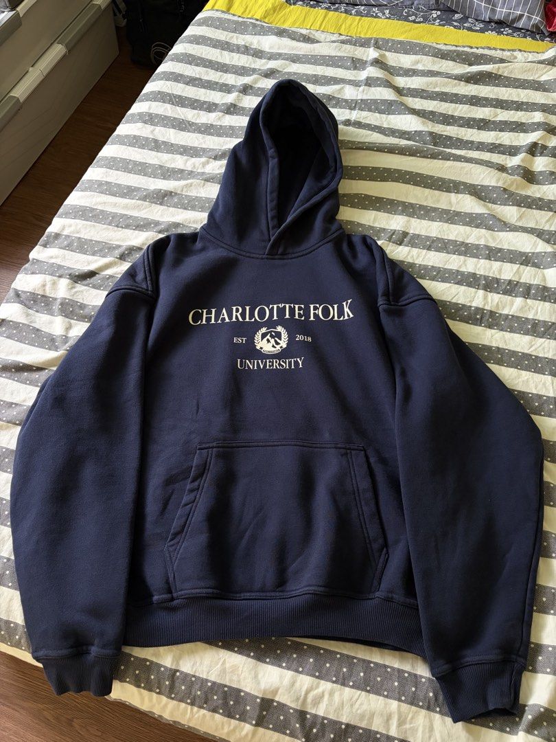 Charlotte Folk Varsity Jacket (Category: Coats, Jackets and Outerwear) located in General Trias. Submitted by makiii10 (Listing ID 1467826378, Image 3). Description: Charlotte Folk Varsity Hoodie Navy blue (Personal item) 90% cotton and 10% polyester Oversized Fit Unisex Silkscreen Print - Condition: Worn 2-3 times only with zero flaws -RFS: Decluttering Can provide more actual photos upon request. Original retail price - Php 2,590.