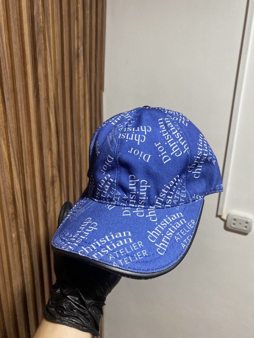 Christian Dior Blue Atelier Print Baseball Cap (Category: Caps & Hats) located in Caloocan City. Submitted by heatedcaps4425 (Listing ID 1467804249, Image 3). Description: - Brand: Christian Dior Atelier - Color: Royal blue with white text print and black leather brim edge - Material: 100% polyester (Made in Italy, Designed in LA) - Interior: Brown lining with adjustable back strap - Condition: Excellent / Pre-loved (ready to wear).