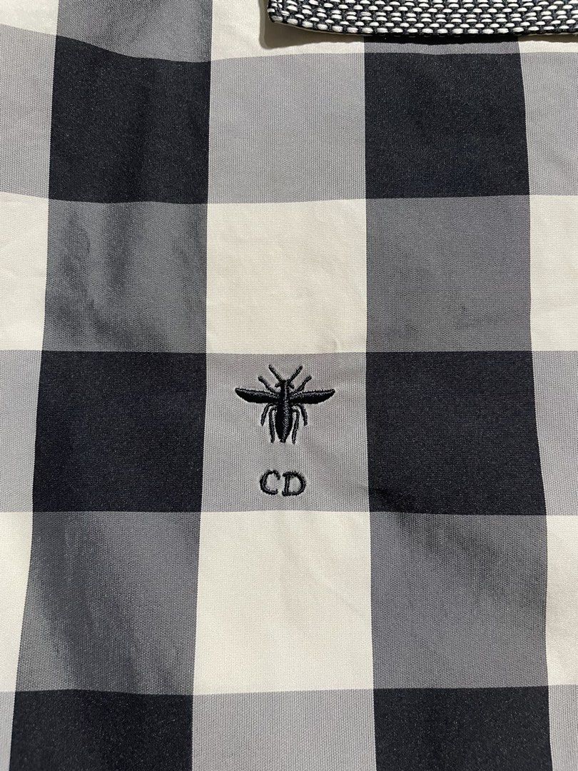 Christian Dior SS23 Checked Anorak Jacket (Category: Coats, Jackets and Outerwear) located in Taguig. Submitted by sellnbustle (Listing ID 1467728193, Image 3). Description: Christian Dior SS23 Checked Anorak Jacket Made in Italy 347C10A2995 Like new condition Chrisian dior markings on hardware Pit to pit: 27” Length: 29” .