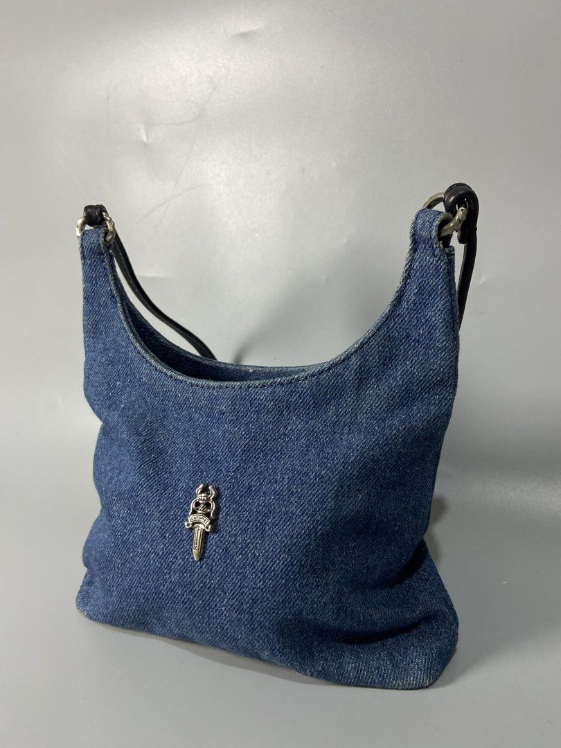 Chrome Hearts Blue Denim Shoulder Bag with Silver Hardware (Category: Shoulder Bags) located in Cavite. Submitted by jayson_04 (Listing ID 1467838788, Image 2). Description: - Style: Everyday compact shoulder bag - Material: Blue denim with dark leather strap - Hardware: Silver rings connecting the handle - Accents: Chrome Hearts silver dagger emblem on the front - Branding: Chrome Hearts scroll logo plate on the back.
