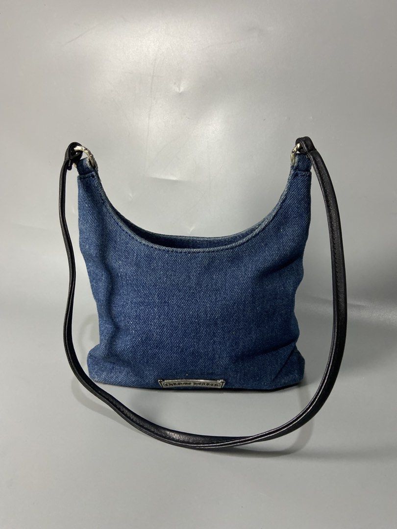 Chrome Hearts Blue Denim Shoulder Bag with Silver Hardware (Category: Shoulder Bags) located in Cavite. Submitted by jayson_04 (Listing ID 1467838788, Image 3). Description: - Style: Everyday compact shoulder bag - Material: Blue denim with dark leather strap - Hardware: Silver rings connecting the handle - Accents: Chrome Hearts silver dagger emblem on the front - Branding: Chrome Hearts scroll logo plate on the back.