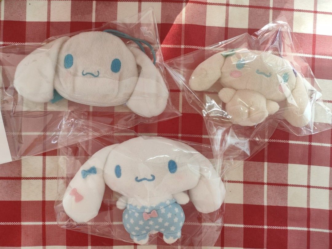 Cinnamoroll plushie charms (Category: Plushies & Soft Toys) located in Bulacan. Submitted by hunterherojapanjdm (Listing ID 1467683532, Image 1). Description: -Cinnamoroll face zipper pouch P120 -a peach-toned Sanrio Baby Cinnamoroll mini mascot P 100 -a Cinnamoroll plush wearing star-patterned overalls with small ribbons. P150.