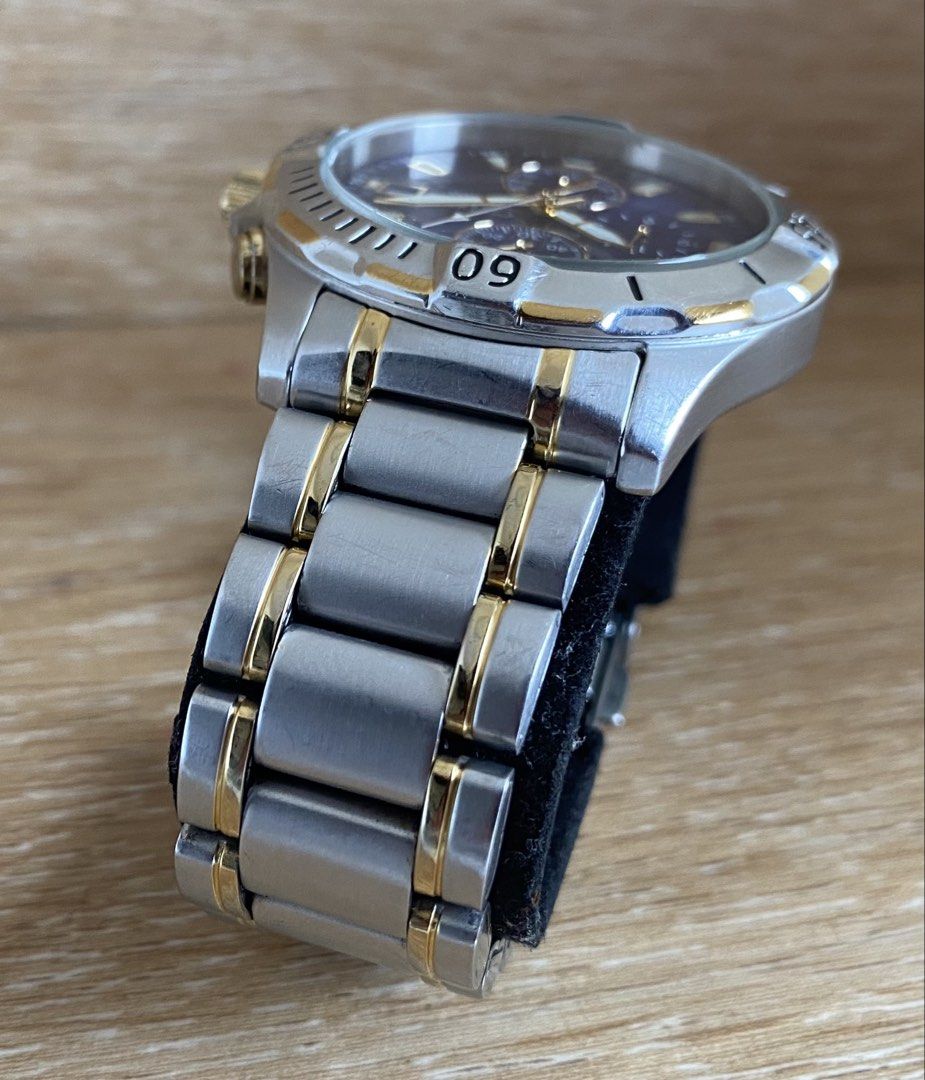 Citizen Chronograph WR 100 Two-Tone Watch (Category: Men's Watches) located in Manila. Submitted by timeisgoldyoyongpinoy (Listing ID 1467815912, Image 3). Description: FOR SALE!🙂 ORIGINAL Citizen Quartz Chronograph •Model AN3394-59L • Dial: Striking deep blue finish featuring three chronograph sub-dials, a date complication window at the 3 o’clock position, and luminous gold-tone skeletonized hands and indices. • Case & Bezel: A robust 39mm–41m