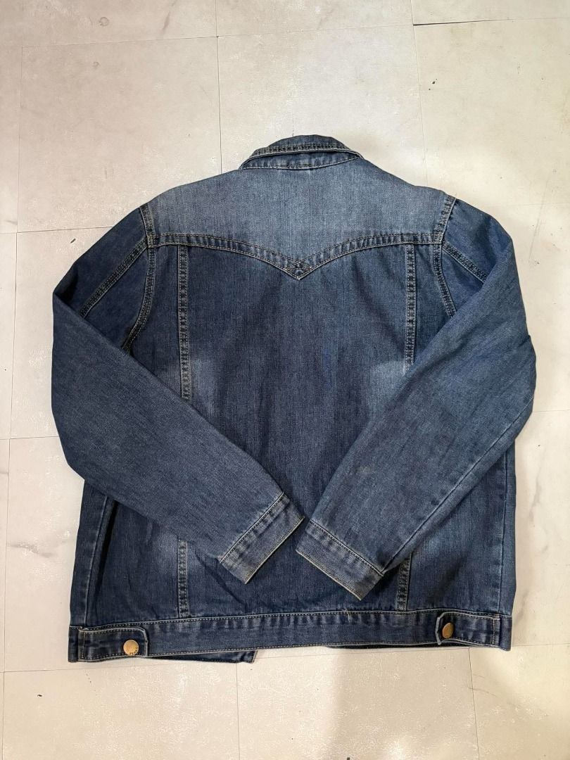 Classic Blue Denim Jacket with Brass Buttons (Category: Coats, Jackets and Outerwear) located in Caloocan City. Submitted by gentleturtle_2ab215 (Listing ID 1467624889, Image 2). Description: - Color/Wash: Dark blue denim with a classic faded wash on the sleeves and front - Details: Contrast stitching and gold-tone metal buttons on front, cuffs, and waist tabs - Pockets: Two chest flap pockets and vertical side welt pockets - Design: Regular coll