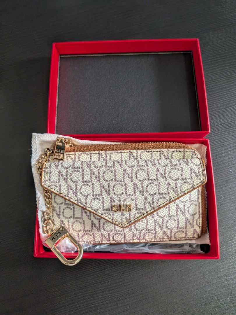CLN Ave Card Holder (with Box & Dust Bag) (Category: Wallets & Card holders) located in Valenzuela. Submitted by andreaaah (Listing ID 1467757722, Image 1). Description: No major flaws, scratches, or peeling. Needs a bit of cleaning on the front and has minor fading on the handle (see photos). Shows normal signs of use..