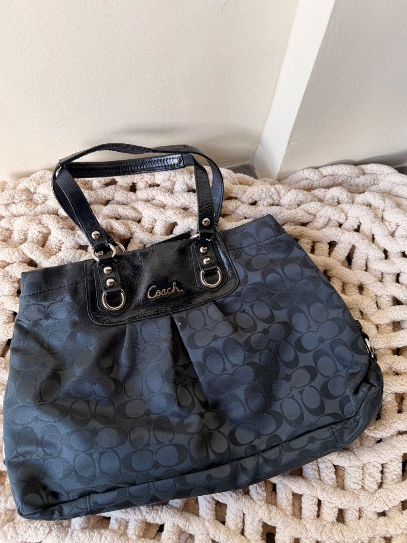 Coach Ashley Vintage Bag (Category: Shoulder Bags) located in San Pedro. Submitted by nicholei.10 (Listing ID 1467739564, Image 1). Description: - Authentic Coach black tote bag in signature C jacquard fabric - Elegant patent leather trim, handles, and front script logo panel - Silver-tone hardware with matching black patent hangtag included - Secure zip-top closure and convenient magnetic snap inner compartments - Clean black fabric lining equip