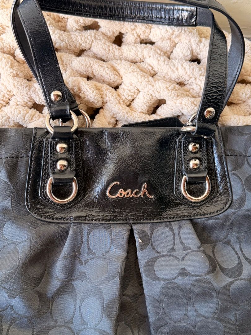 Coach Ashley Vintage Bag (Category: Shoulder Bags) located in San Pedro. Submitted by nicholei.10 (Listing ID 1467739564, Image 3). Description: - Authentic Coach black tote bag in signature C jacquard fabric - Elegant patent leather trim, handles, and front script logo panel - Silver-tone hardware with matching black patent hangtag included - Secure zip-top closure and convenient magnetic snap inner compartments - Clean black fabric lining equip