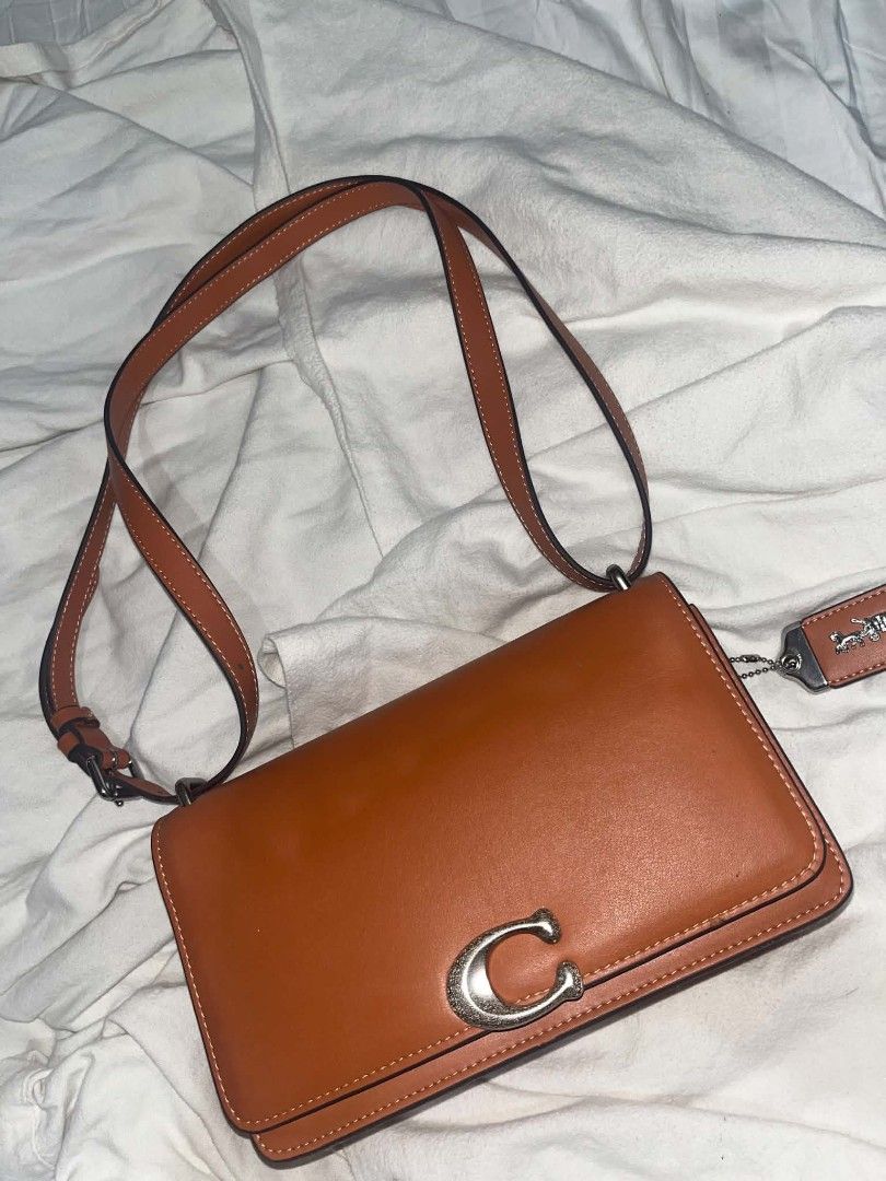 COACH BANDIT CROSS BODY BAG (Category: Luxury Bags & Wallets) located in Taguig. Submitted by mikacxz (Listing ID 1467733170, Image 2). Description: - OFF ! pre/mium co/py - used twice only ! - with coach dust bag.