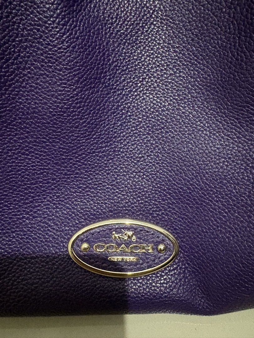Original Coach Purple Leather Shoulder Bag (Category: Luxury Bags & Wallets) located in Quezon City. Submitted by everything99_ (Listing ID 1467765872, Image 2). Description: - Brand: Coach - Material: Premium pebble leather in a gorgeous purple shade - Hardware: Elegant gold-tone hardware with front Coach plaque & metallic hangtag - Compartments: Spacious interior with a secure zippered middle divider and extra slip pockets - Lining: Clean purpl