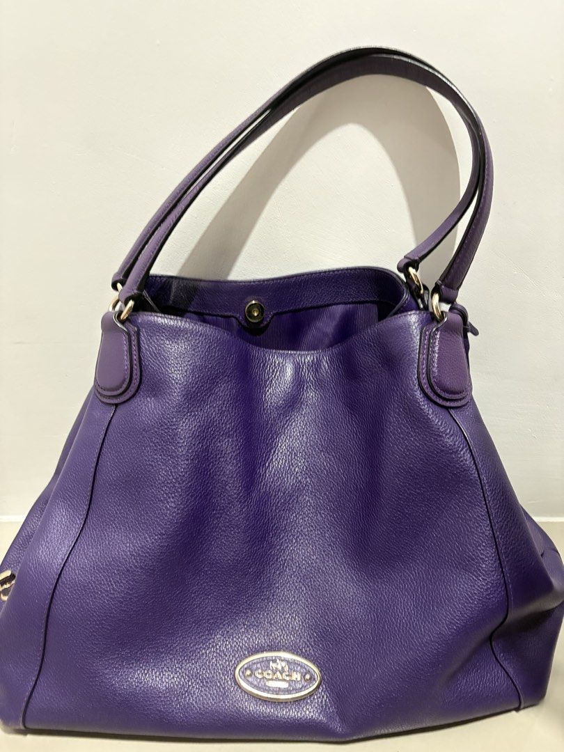 Original Coach Purple Leather Shoulder Bag (Category: Luxury Bags & Wallets) located in Quezon City. Submitted by everything99_ (Listing ID 1467765872, Image 1). Description: - Brand: Coach - Material: Premium pebble leather in a gorgeous purple shade - Hardware: Elegant gold-tone hardware with front Coach plaque & metallic hangtag - Compartments: Spacious interior with a secure zippered middle divider and extra slip pockets - Lining: Clean purpl