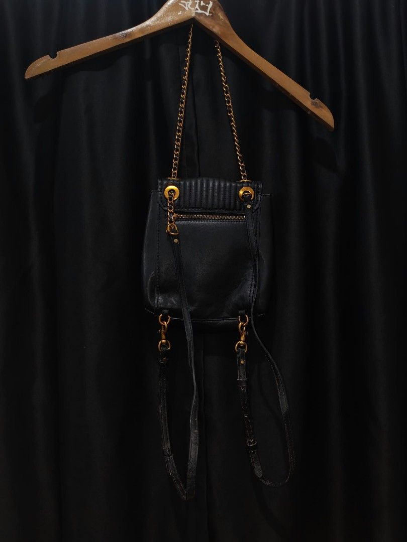 Coach Quilted Leather Backpack Black Gold Hardware (Category: Backpacks) located in Baguio. Submitted by solo_ukay (Listing ID 1467777571, Image 2). Description: - Authentic Coach black quilted leather backpack - Elegant gold-tone hardware with classic turnlock closure - Versatile wear with chain shoulder straps and adjustable leather back straps - Convenient exterior zipper pocket on the back - Beautiful deep maroon interior lining complete with