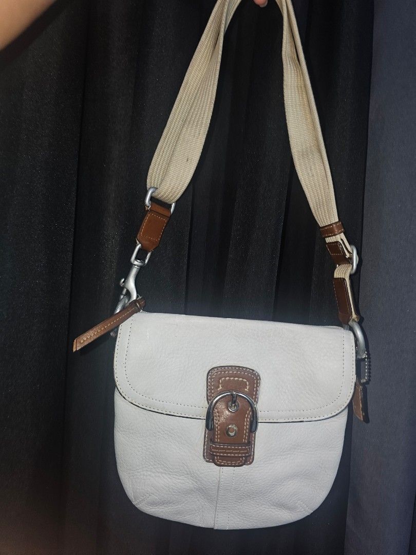 Coach soho flap White Leather Bag (Category: Cross-body Bags) located in Marikina City. Submitted by lalala60325 (Listing ID 1467772354, Image 2). Description: Good condition, sign 0f usage in leather replaced strap Can send vid for bag condition No return No refund..