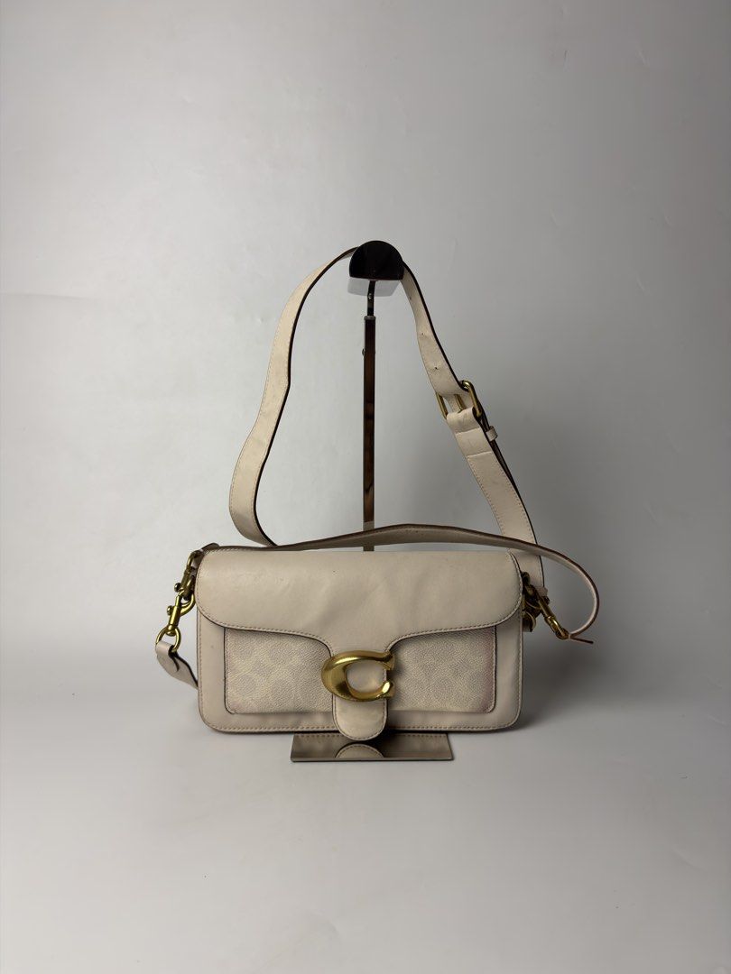Coach Tabby 26 Two-Way Bag (Category: Luxury Bags & Wallets) located in Manila. Submitted by streetsavvy (Listing ID 1467705655, Image 3). Description: Coach Tabby 26 Two-Way Bag Width: 10” Height: 5” Depth: 2” Strap Drop: 8” Sling drop: 21” Measured in Inches Condition: Good condition with signs of wear Flaw: Velvet bleeding and minor purple stain on front.