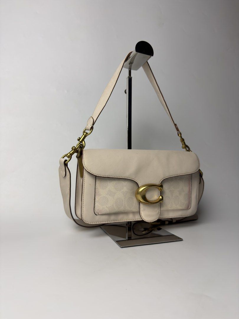 Coach Tabby 26 Two-Way Bag (Category: Luxury Bags & Wallets) located in Manila. Submitted by streetsavvy (Listing ID 1467705655, Image 2). Description: Coach Tabby 26 Two-Way Bag Width: 10” Height: 5” Depth: 2” Strap Drop: 8” Sling drop: 21” Measured in Inches Condition: Good condition with signs of wear Flaw: Velvet bleeding and minor purple stain on front.
