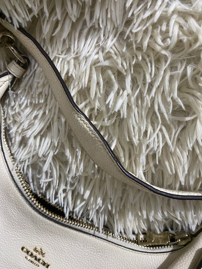 Coach teri hobo bag (Category: Luxury Bags & Wallets) located in Antipolo. Submitted by switchneighborhood (Listing ID 1467748120, Image 3). Description: - Brand: Coach - Material: Premium white pebbled leather - Hardware: Elegant gold-tone accents - Closure: Secure top zipper - Interior: Dark fabric lining with one zip pocket and one slip pocket - Details: Includes a single strap with side rings and signature hangtag - Condition: Clean interior 