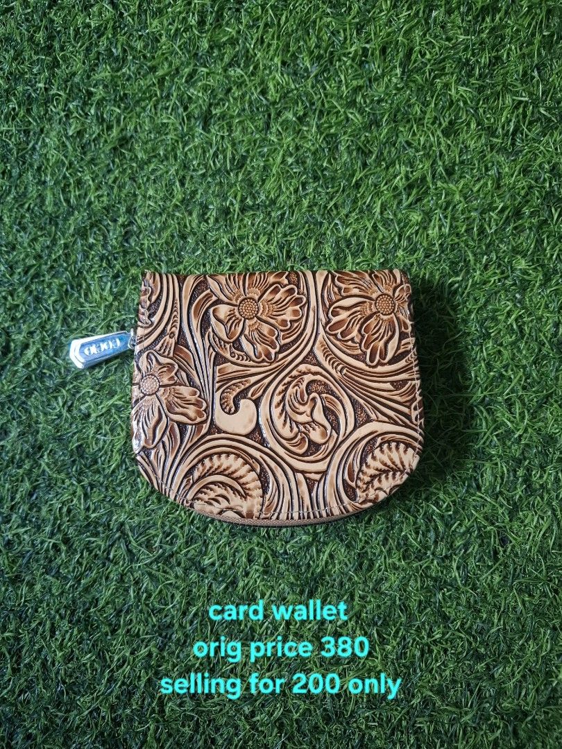 Cocio Floral Embossed Leather Card Wallet (Category: Wallets & Card holders) located in Pasay City. Submitted by emilia1102 (Listing ID 1467798100, Image 1). Description: - Tan card wallet with stylish floral tooling - Accordion-style interior slots featuring 'Cocio' pattern - Secure zipper closure with metal pull tab - Compact and handy for organizing multiple cards - Original price: ₱380 | Selling price: ₱200.