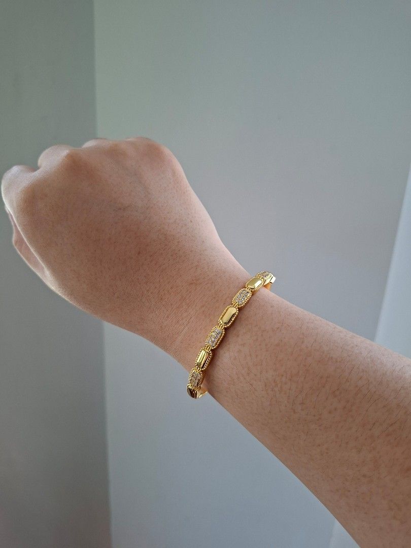 Coffee Beans Shape Pattern Gold Stainless Steel Bangle Bracelet (Category: Bracelets) located in Dasmarinas. Submitted by danabrie22 (Listing ID 1467718800, Image 2). Description: very well-made, excellent crafstmanship 10/10 condition brand new stainless steel & colored cubic zirconia stones made in Hongkong.