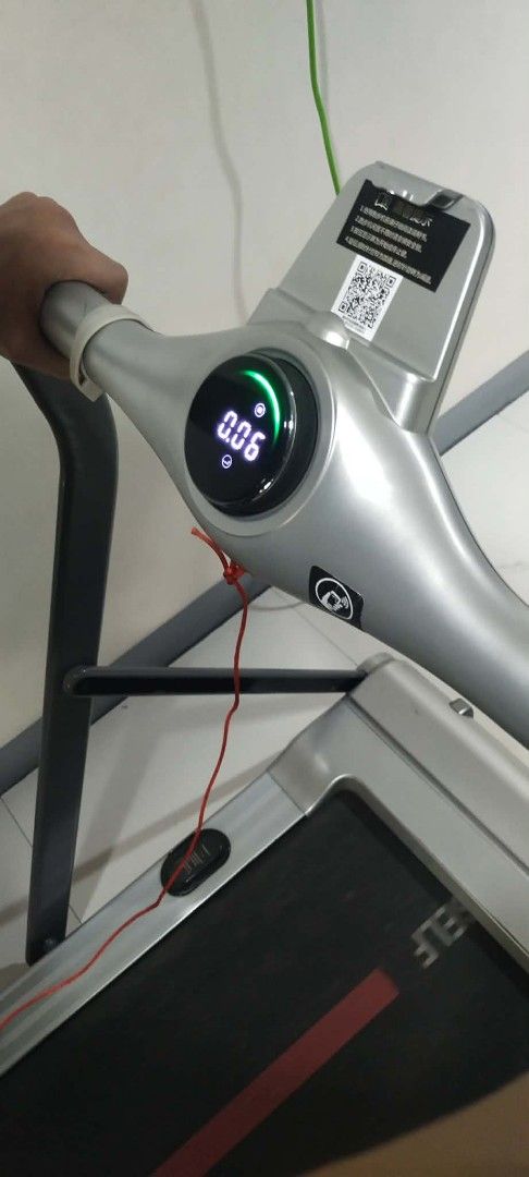 Compact Electric Treadmill with Digital Display (Category: Cardio & Fitness Machines) located in Manila. Submitted by yorkie112643153 (Listing ID 1467654812, Image 1). Description: Working po ito nakatambak lang BINONDO MANILA - Electric treadmill with a clear digital display for workout metrics - Compact footprint, perfect for home workouts and small spaces - Sleek silver frame with a black running belt, red center stripe, and branding - Include