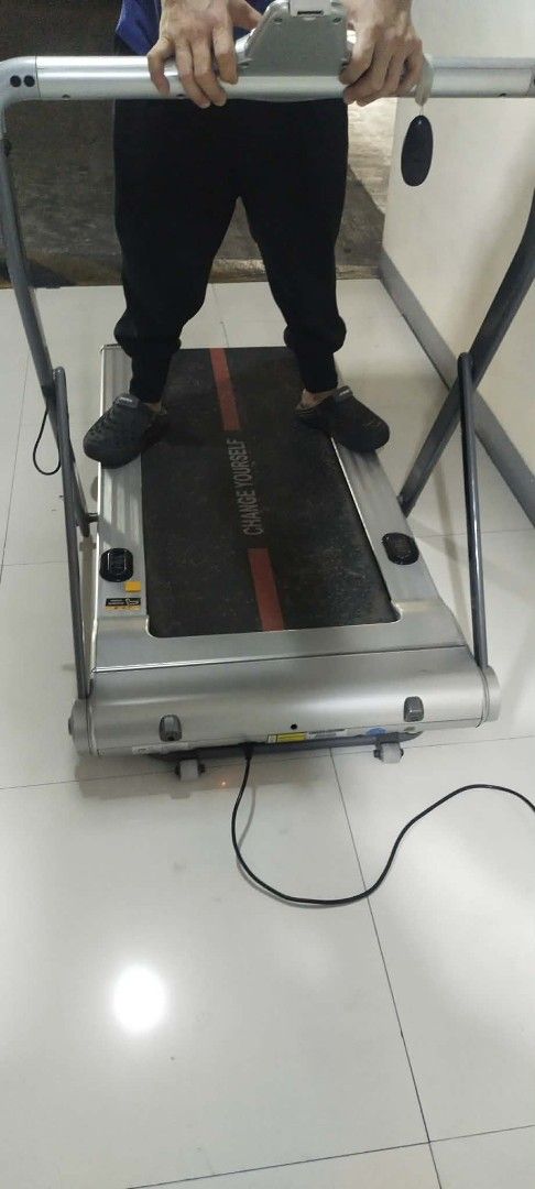 Compact Electric Treadmill with Digital Display (Category: Cardio & Fitness Machines) located in Manila. Submitted by yorkie112643153 (Listing ID 1467654812, Image 3). Description: Working po ito nakatambak lang BINONDO MANILA - Electric treadmill with a clear digital display for workout metrics - Compact footprint, perfect for home workouts and small spaces - Sleek silver frame with a black running belt, red center stripe, and branding - Include
