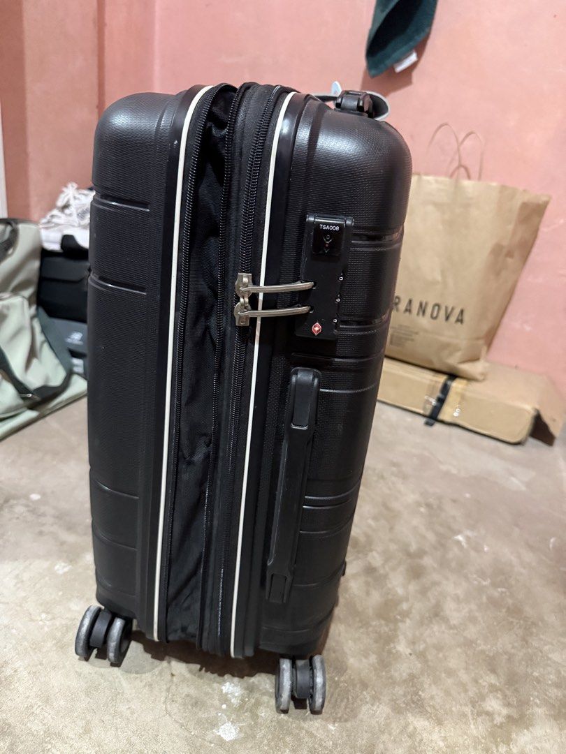 Compass Hard Shell Spinner Luggage Black (Category: Luggage) located in Rizal. Submitted by ivagabond (Listing ID 1467605686, Image 2). Description: Hand carry luggage - Brand: Compass - Color: Sleek black hard shell - Mobility: 4 smooth spinner wheels & retractable telescoping handle - Security: Built-in side TSA combination lock - Interior: Lined compartments, zippered mesh pockets, and secure packing straps - Condition: Clean interior with no 