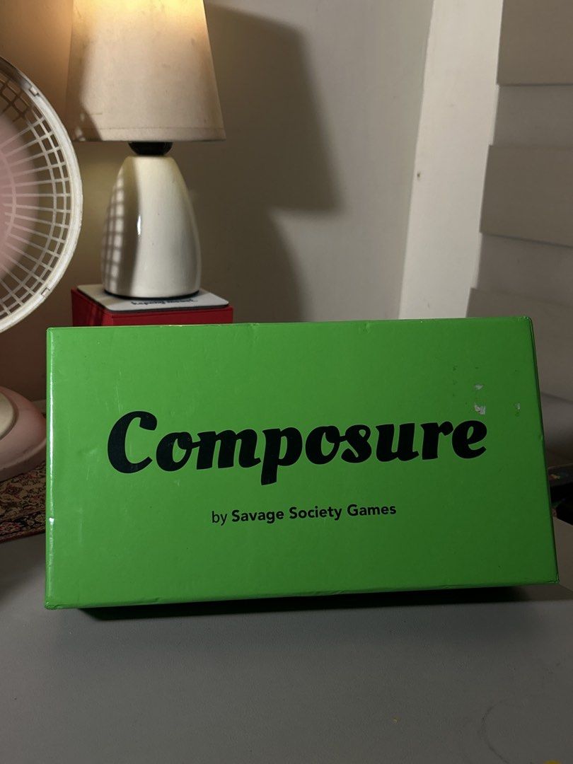 Composure Board Game by Savage Society Games (Category: Board Games & Puzzles) located in Santa Rosa. Submitted by sailorplatinum143 (Listing ID 1467794372, Image 1). Description: - Game: Composure party game by Savage Society Games - Condition: Complete set, cards still sealed in plastic - Inclusions: Green outer box, card decks, rolls of blank paper/tokens, and skull/monkey sticker sheets - Vibe: Fun adult card game to test friendships and comp