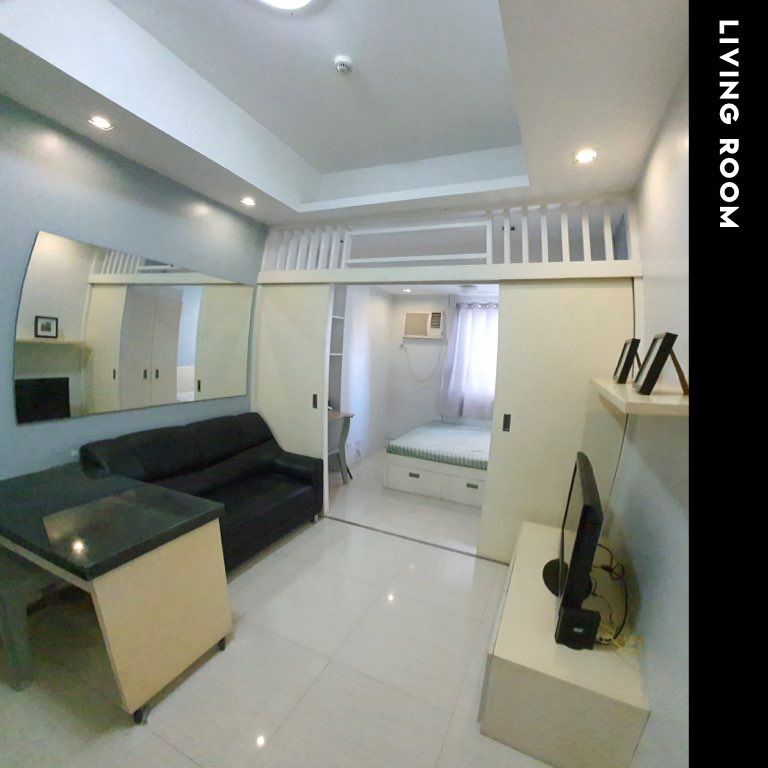 Condo for Rent: Pearl Place Ortigas (Category: Apartments & Condos) located in Caloocan City. Submitted by ryderaquino (Listing ID 1467678937, Image 1). Description: Enjoy convenient city living in Unit 14J at The Pearl Place, Ortigas. This thoughtfully furnished 23sqm unit features a queen-sized bed, sliding dividers for privacy, ample built-in storage, a study nook, and a kitchen equipped with appliances and a movable granite-top dining and pre