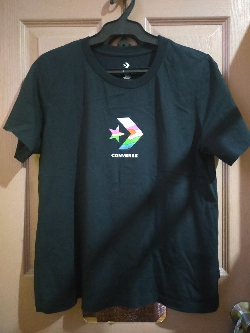 Converse Shirt (Category: Shirts) located in Quezon City. Submitted by leejong720610 (Listing ID 1467696077, Image 1). Description: This is a black Converse short-sleeve t-shirt featuring the colorful sunrise-filled Star Chevron graphic logo on the chest. Medium.