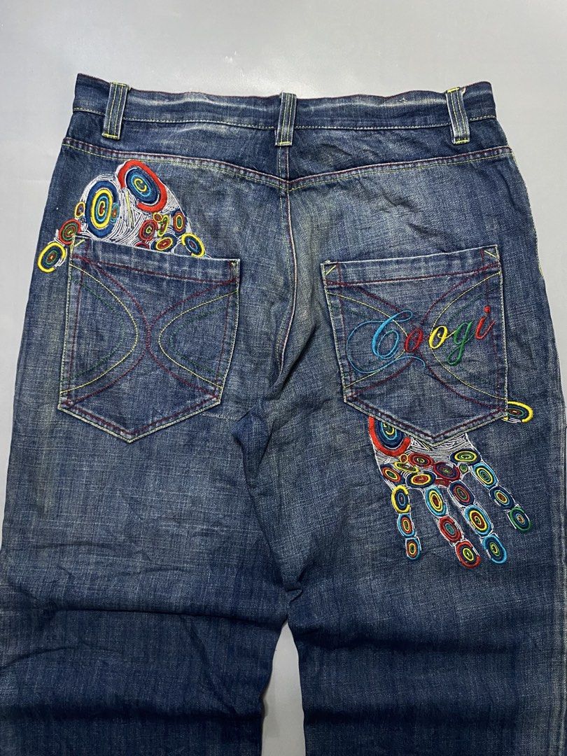 Coogi Embroidered Hand Jeans Denim Pants (Category: Jeans) located in Manila. Submitted by delunakenn94368 (Listing ID 1467757426, Image 1). Description: - Brand/Style: Vintage Coogi dark blue denim jeans with a relaxed Y2K streetwear fit - Details: Heavy colorful embroidery on back pockets and legs, including hand graphics and geometric patterns - Branding: Iconic script Coogi logo embroidered on the pocket - Condition: Natural hem fraying and d