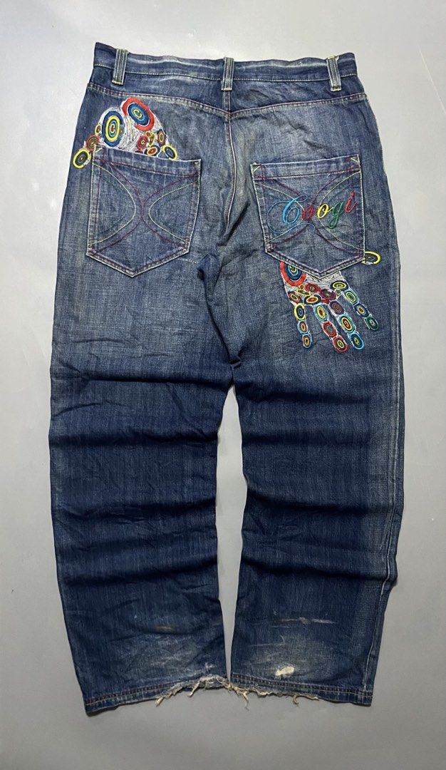 Coogi Embroidered Hand Jeans Denim Pants (Category: Jeans) located in Manila. Submitted by delunakenn94368 (Listing ID 1467757426, Image 2). Description: - Brand/Style: Vintage Coogi dark blue denim jeans with a relaxed Y2K streetwear fit - Details: Heavy colorful embroidery on back pockets and legs, including hand graphics and geometric patterns - Branding: Iconic script Coogi logo embroidered on the pocket - Condition: Natural hem fraying and d