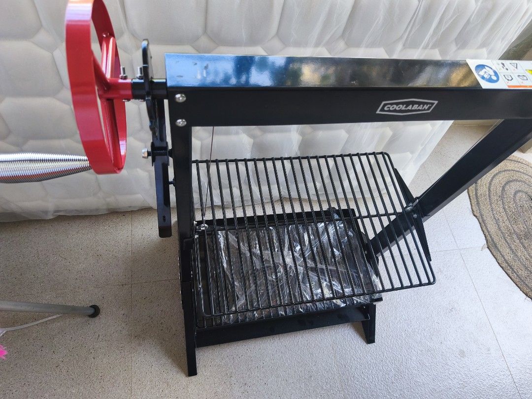 Coolabah Adjustable Height Charcoal BBQ Grill (Category: BBQ, Grills & Hotpots) located in Tarlac. Submitted by ibrahimharb81 (Listing ID 1467744388, Image 2). Description: - Brand: Coolabah Charcoal Grill - Color: Black - Condition: Brand new, never fired up, zero smoke damage (plastic wrap still on lower parts) - Features: Side crank handle for easy cooking grate height adjustment - Build: Sturdy metal frame that stands firmly on legs - Ideal f