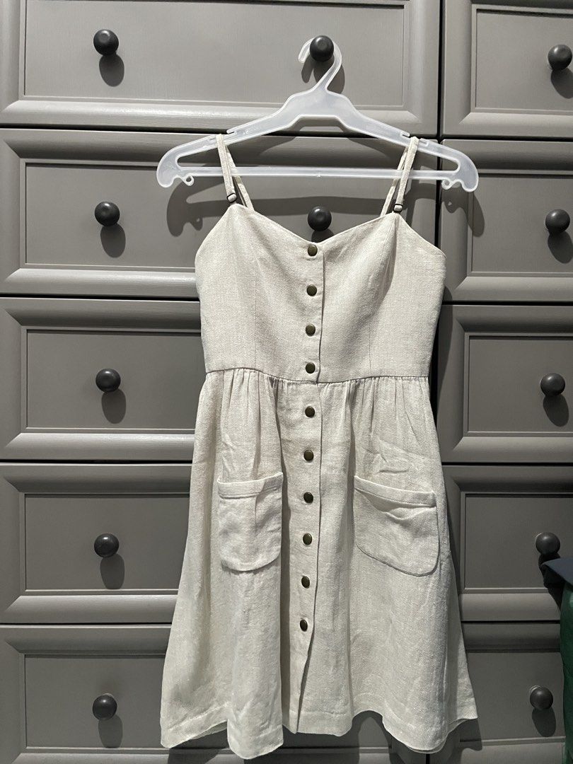 COPE Beige button-front cami midi dress and has front patch pockets. (Category: Dresses) located in Taguig. Submitted by lykamangubat (Listing ID 1467706833, Image 1). Description: .