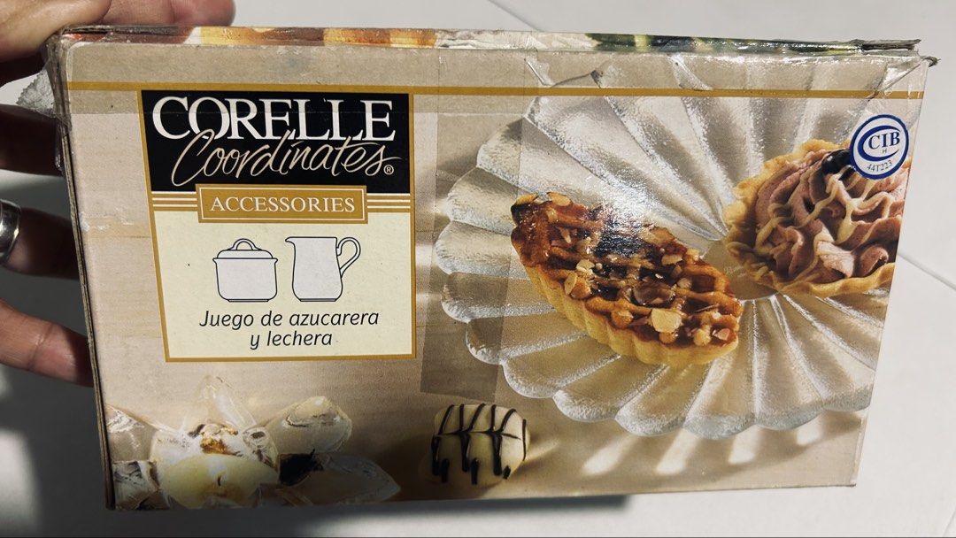 Corelle Coordinates Shadow Iris Sugar and Creamer Set (Category: Coffee & Tea Tableware) located in General Trias. Submitted by csrtechsol61982 (Listing ID 1467649426, Image 3). Description: - Brand: Corelle Coordinates - Pattern: Shadow Iris (floral design) - Material: Durable white ceramic - Set includes: Sugar bowl and creamer - Condition: Brand new in original box/packaging - Ideal for coffee/tea service or gifting.