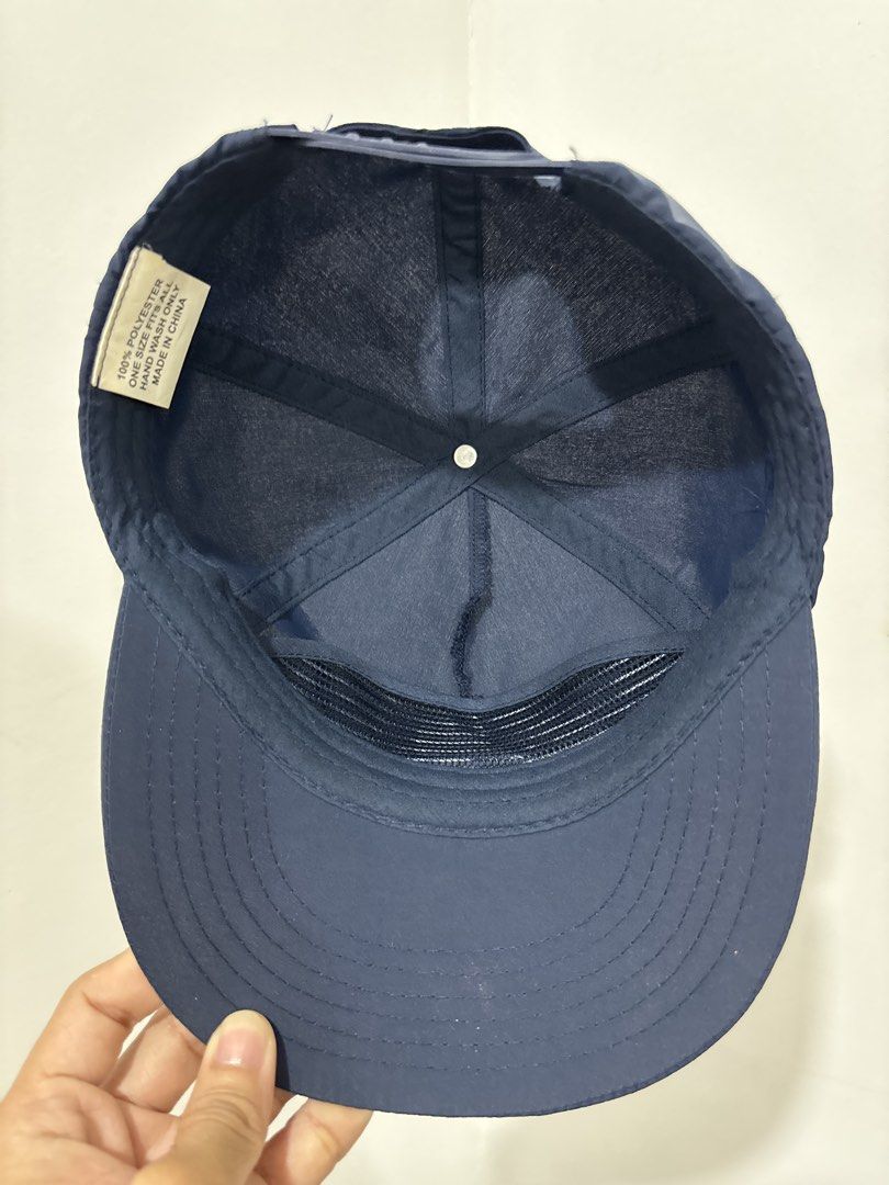 Corona Extra x WSL Navy Blue Cap (Category: Caps & Hats) located in Marikina City. Submitted by zaxcheus_castillo1708 (Listing ID 1467673152, Image 3). Description: - Official Corona Extra x WSL collaboration baseball cap in dark blue - Features crisp white embroidered logos on the front panel - Made from 100% lightweight and breathable polyester - Adjustable strap closure for a customizable fit - Clean interior lining with taped seams for added 